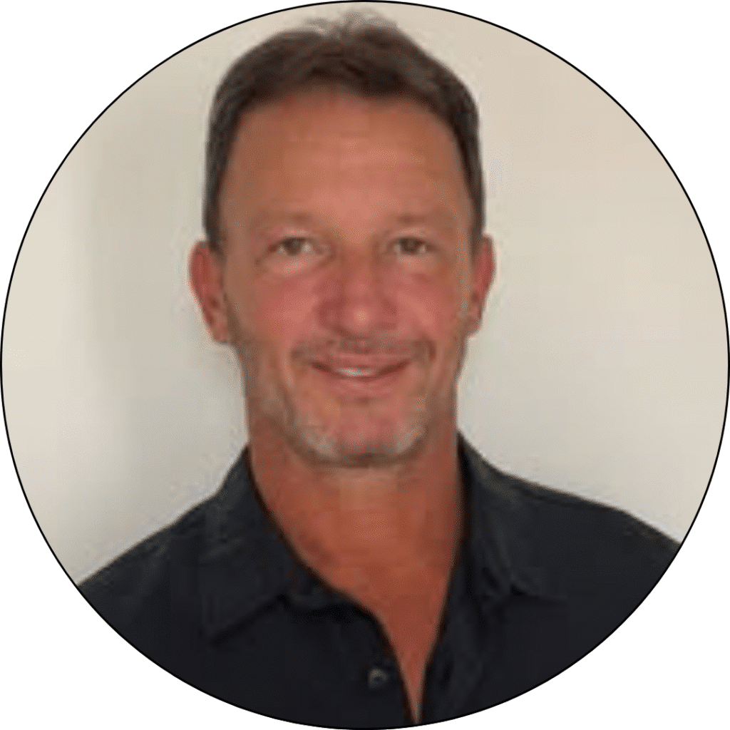 Alvaro Guarana, Sales Leader at United Construction Group Hawaii, smiling in a professional setting, highlighting his commitment to personalized construction services.