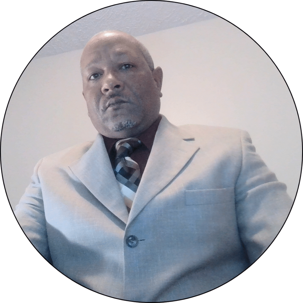 Professional portrait of Brent Dixon, Sales Leader at United Construction Group Hawaii, wearing a light gray suit with a patterned tie, emphasizing expertise and commitment to customer satisfaction in construction services.